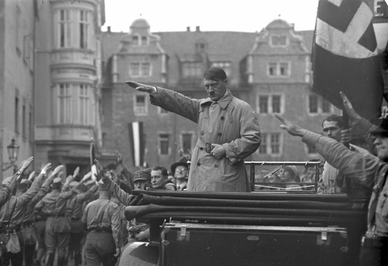Adolf Hitler gives the salute at the parade of Storm troopers in Weimar